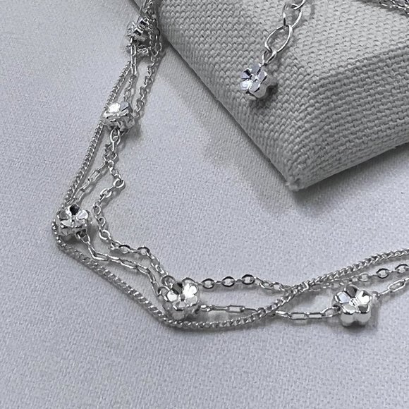 Bright Silver Toned Three Strand 9” Chain Ankle Bracelet with Small Flower Charm - Picture 2 of 4